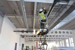 Jackson Fire engineer Scott Hughes working on the new detection and alarm system being installed at the new Moneypenny HQ, Wrexham