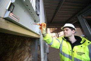 Jackson Fire engineer Rob Jones, working on the new detection and alarm system being installed at the new Moneypenny HQ, Wrexham. In the background is the tree house feature that Moneypenny is adding